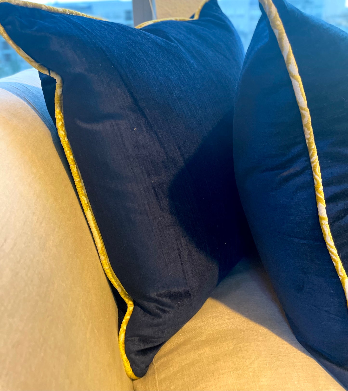 Cobalt blue velvet pillows with citron yellow welt