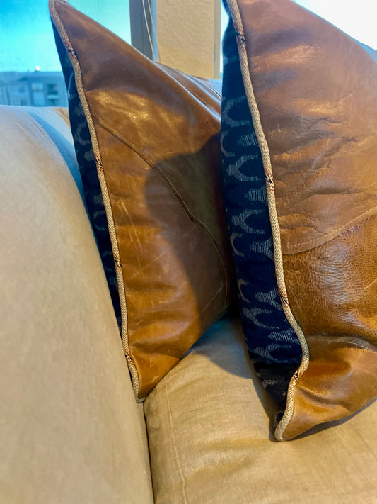 Live edge leather pillows with ranch welt edge and cobalt blue blanket pattern wool